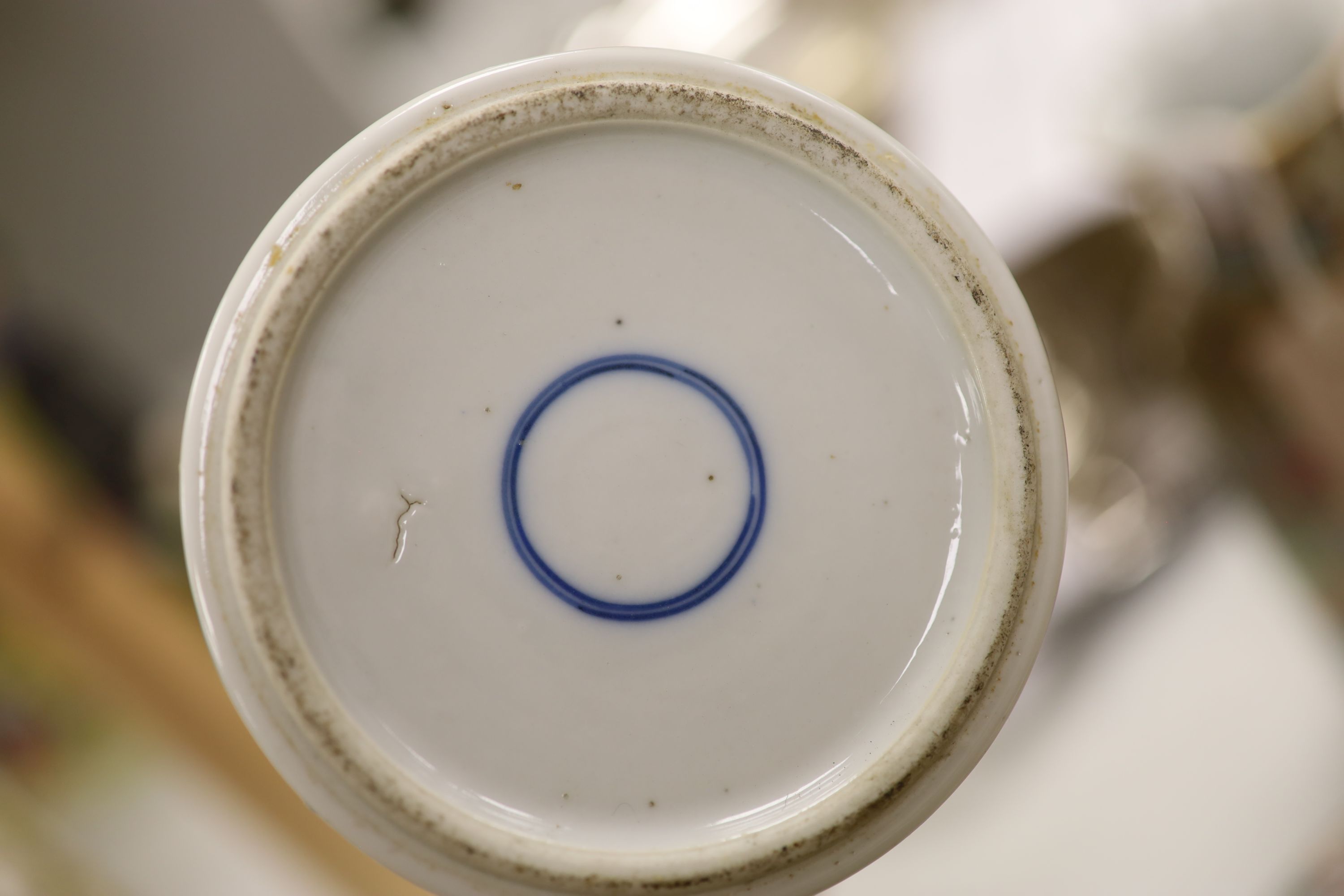 An early 20th century Chinese blue and white ‘prunus’ vase a Republic period millefleur dish, a similar Canton vase and two blue and white jars